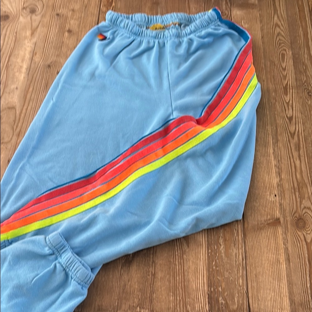 Aviator Nation Blue Track Pants with Rainbow Stripes